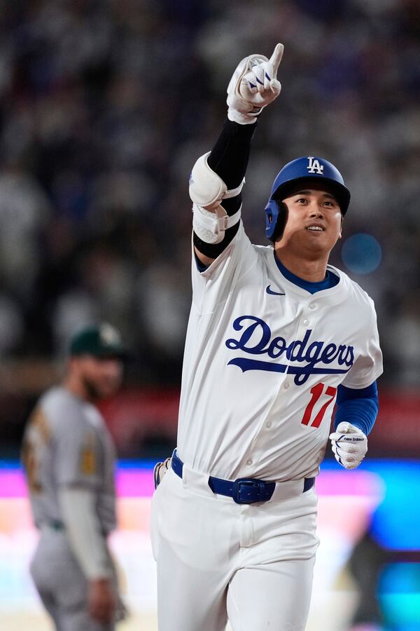 Los Angeles Dodgers' Shohei Ohtani runs the bases after hitting a three-run home run during the third inning of a baseball game against the Athletics, Thursday, May 15, 2025, in Los Angeles. (AP Photo/Mark J. Terrill)