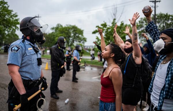 FILE - Protesters and police face each other during a rally against the death of George Floyd in Minneapolis on Tuesday, May 26, 2020. (Richard Tsong-Taatarii/Star Tribune via AP, file)