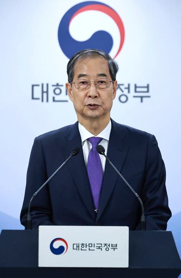South Korean acting President Han Duck-soo speaks during a press conference at the Government Complex in Seoul, South Korea, Thursday, May 1, 2025. (Hong Hae-in/Yonhap via AP)