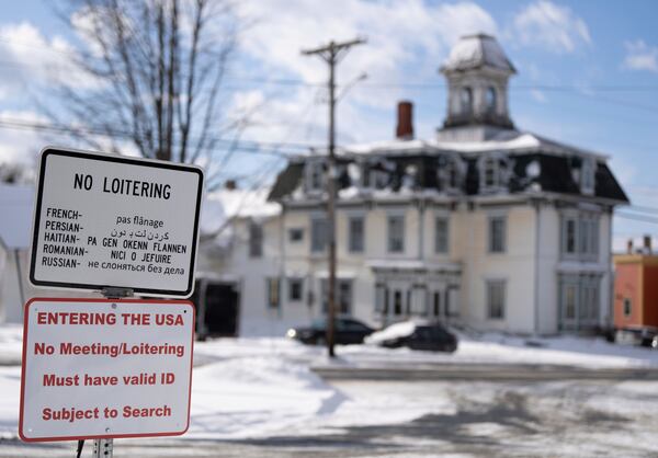 A sign on an unpatrolled border street entering into Derby Line, Vermont, U.S.A., from Stanstead, Quebec, Tuesday, Jan. 21, 2025. (Christinne Muschi/The Canadian Press via AP)