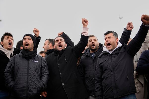 People chant slogans as they protest outside the Vatan Security Department, where Istanbul Mayor Ekrem Imamoglu is expected to be taken following his arrest in Istanbul, Turkey, on Wednesday, March 19, 2025. (AP Photo/Emrah Gurel)