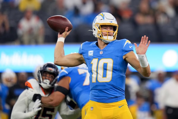 Los Angeles Chargers quarterback Justin Herbert (10) throws a pass during the first half an NFL football game against the Denver Broncos, Thursday, Dec. 19, 2024, in Inglewood, Calif. (AP Photo/Eric Thayer)