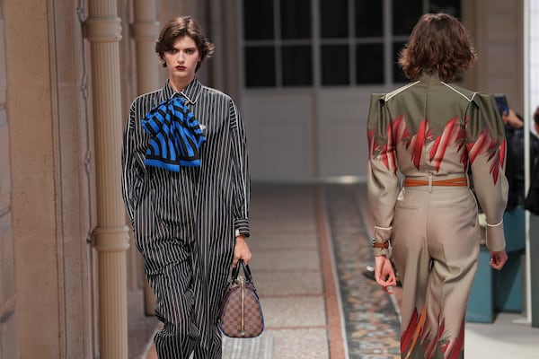 Models wear creations as part of the Louis Vuitton Fall/Winter 2025-2026 Womenswear collection presented in Paris, Monday, March 10, 2025. (Photo by Scott A Garfitt/Invision/AP)