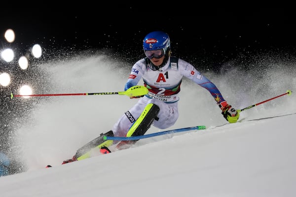 FILE - United States' Mikaela Shiffrin speeds down the course during the first run of an alpine ski women's World Cup slalom, in Schladming, Austria, Tuesday, Jan. 11, 2022. (AP Photo/Marco Trovati, File)