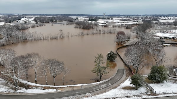 A high-rising Barren River flows through Bowling Green, Ky., Sunday, Feb. 16, 2025, after heavy rainfall beginning early Saturday morning brought nearly five inches of rain and snowfall to Warren County. (Jack Dobbs/Daily News via AP)