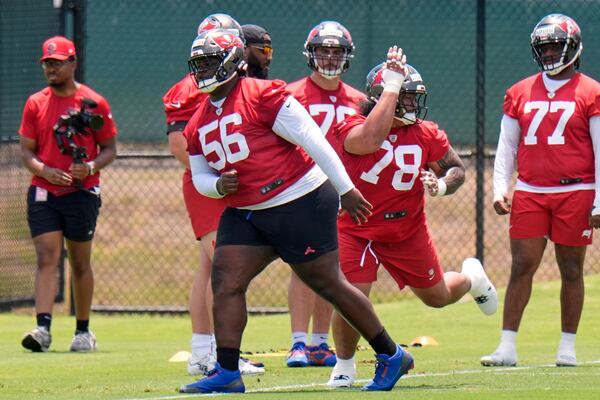 Tampa Bay Buccaneers nose tackle Desmond Watson (56) works against Dvon J-Thomas (78) during the NFL football team's rookie minicamp Friday, May 9, 2025, in Tampa, Fla. (AP Photo/Chris O'Meara)