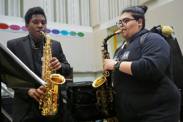 Courtney Brunson, left, and Steevan Galindo play saxophones during a rehearsal at Stax Music Academy, Thursday, Jan. 30, 2025, in Memphis, Tenn. (AP Photo/George Walker IV)