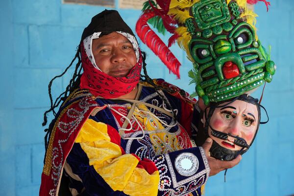 Freddy De Leon poses for a portrait in his Prince Tecun Uman costume before performing the Dance of the Conquest of Guatemala on the feast day of the Black Christ of Esquipulas in Tejutla, in Guatemala's San Marcos department, Wednesday, Jan. 15, 2025. (AP Photo/Moises Castillo)