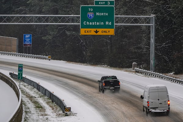 Vehicles move slowly on Interstate 575 during a winter storm, Friday, Jan. 10, 2025, in Kennesaw, Ga. (AP Photo/Mike Stewart)