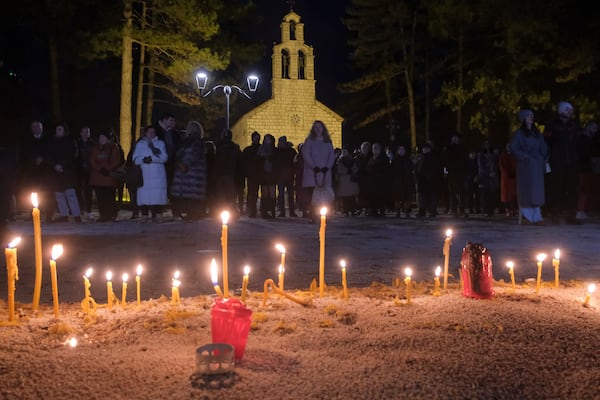 Several thousand people participated in a protest demanding the resignations of top security officials over a shooting earlier this week in Cetinje, outside of Podogrica, Montenegro, Sunday, Jan. 5, 2025. (AP Photo/Risto Bozovic)