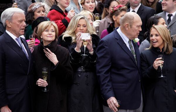 FILE - Former NBC "Today" television program hosts Tom Brokaw, left, Jane Pauley, second left, Deborah Norville, center, and Katie Couric, right, with veteran weatherman Willard Scott, gather for a toast in New York's Rockefeller Center, Jan. 13, 2012. (AP Photo/Richard Drew, File)
