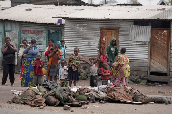 EDS NOTE: GRAPHIC CONTENT - Bodies of alleged members of the Armed Forces of the Democratic Republic of Congo (FARDC), who lost their lives fighting against M23 rebels lie on the street of Goma, Congo, Thursday, Jan. 30, 2025. (AP Photo/Brian Inganga)