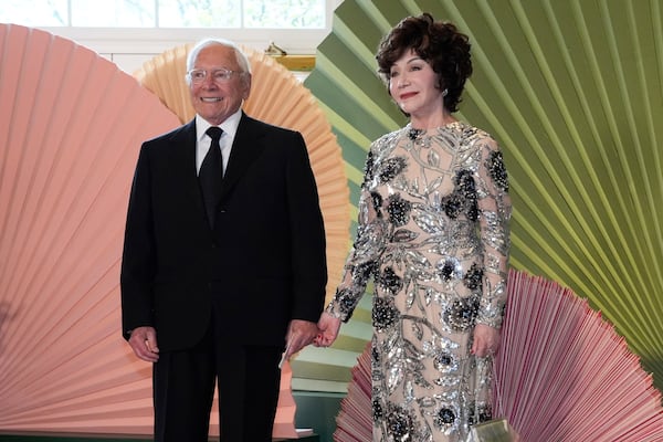 FILE - Lynda Resnick and Stewart Resnick arrive at the Booksellers area of the White House for a state dinner, April 10, 2024, in Washington. (AP Photo/Jacquelyn Martin, File)