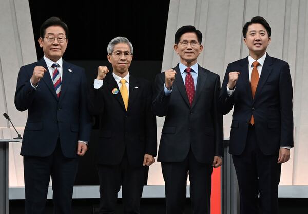 FILE - From left: South Korea's presidential candidates, Lee Jae-myung of the Democratic Party, Kwon Young-guk of the Democratic Labor Party, Kim Moon Soo of the People Power Party and Lee Jun-seok of the New Reform Party pose for photograph ahead of a 3rd televised presidential debate for the forthcoming June 3 presidential election at MBC studio on May 27, 2025 in Seoul, South Korea. (Kim Min-Hee/Kyodo, Pool via AP, File)
