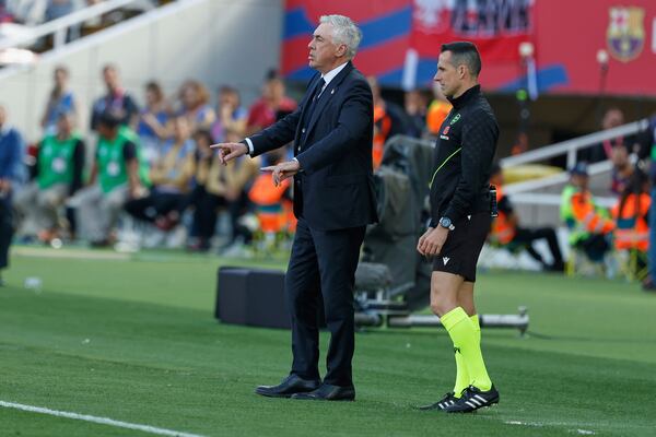 Real Madrid's head coach Carlo Ancelotti gives instructions during the La Liga soccer match between Barcelona and Real Madrid in Barcelona, Spain, Sunday, May 11, 2025. AP Photo/Joan Monfort)