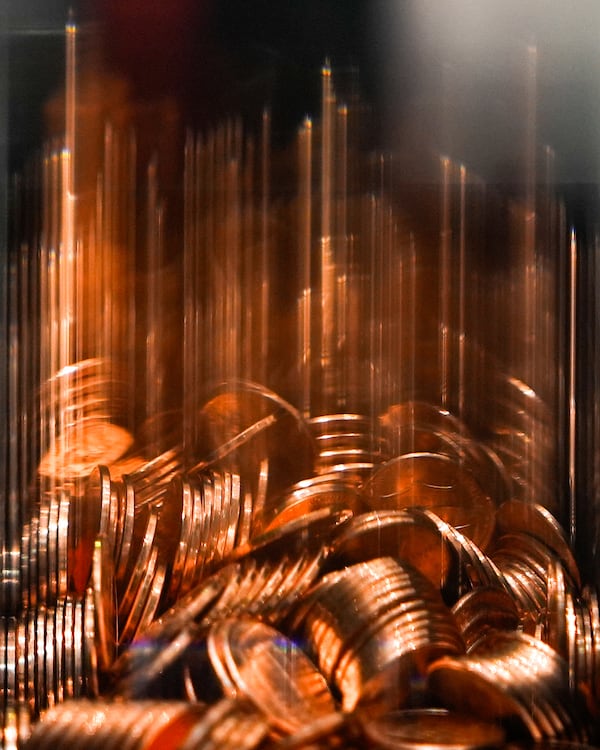 Pennies sit in a penny press machine at the American Dream mall, Sunday, March 2, 2025, in East Rutherford, N.J. (AP Photo/Julia Demaree Nikhinson)