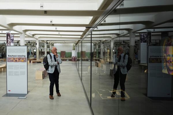 A visitor observes the Museum of Survivors, located in a factory where Oskar Schindler saved some 1200 Jews during the WWII, in Brnenec, Czech Republic, Saturday, May 10, 2025. (AP Photo/Petr David Josek)