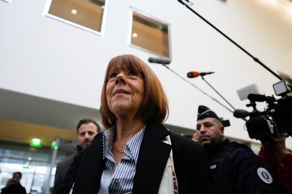 Gisele Pelicot, who was allegedly drugged by her now former husband so that he and others could assault her, arrives at the court house in Avignon, southern France, Thursday, Dec. 19, 2024. (AP Photo/Lewis Joly)