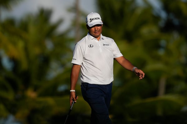 Hideki Matsuyama, of Japan, watches his shot on the 17th green during the first round of the Sony Open golf event, Thursday, Jan. 9, 2025, at Waialae Country Club in Honolulu. (AP Photo/Matt York)