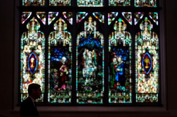 B.C. Premier David Eby is silhouetted while speaking after mass at Holy Rosary Cathedral on a provincial day of mourning for the victims of the vehicle-ramming attack at the Filipino community's Lapu Lapu Day festival last week, in Vancouver, on Friday, May 2, 2025. (Darryl Dyck/The Canadian Press via AP)