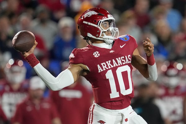 Arkansas quarterback Taylen Green (10) looks to throw a pass during the first half of the Liberty Bowl NCAA college football game against Texas Tech, Friday, Dec. 27, 2024, in Memphis, Tenn. (AP Photo/George Walker IV)