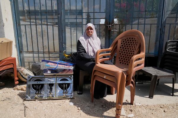 Residents of the now evacuated refugee camp of Tulkarem return to collect belongings before the destruction of their homes as Israeli forces prepare to carry out the demolition of 116 homes across the two refugee camps of the Israeli occupied West Bank city of Tulkarem, Friday, May 2, 2025. (AP Photo/Nasser Nasser)