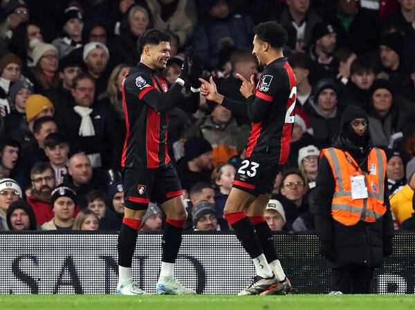 Bournemouth's Francisco Evanilson, left, celebrates after scoring his side's first goal during the English Premier League soccer match between FC Fulham and AFC Bournemouth, in London, Sunday, Dec. 29, 2024. (Steven Paston/PA via AP)