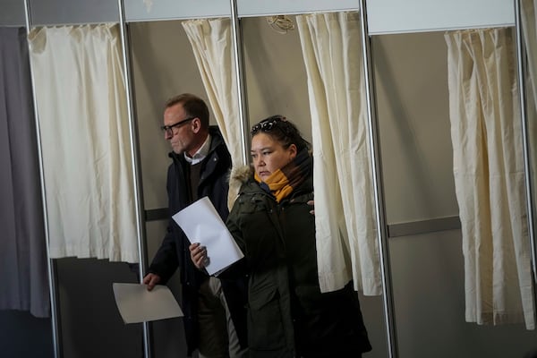 People cast their votes in parliamentary elections in Nuuk, Greenland, Tuesday, March 11, 2025. (AP Photo/Evgeniy Maloletka)