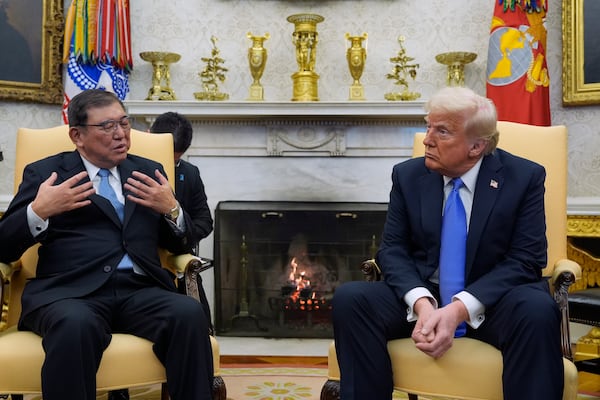 President Donald Trump speaks with Japanese Prime Minister Shigeru Ishiba in the Oval Office of the White House, Friday, Feb. 7, 2025, in Washington. (AP Photo/Alex Brandon)