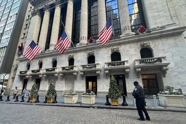 FILE - The New York Stock Exchange is shown in New York's Financial District on Dec. 31, 2024. American flags flew at half-staff there following the death of former U.S. president Jimmy Carter. (AP Photo/Peter Morgan, File)