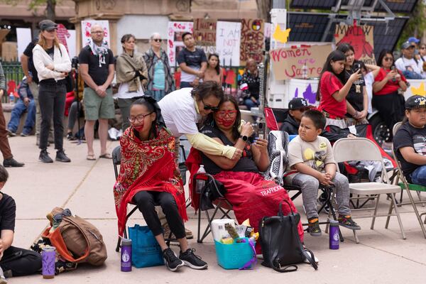 Family members listen to speeches at a Missing Murdered Indigenous People awareness rally in Santa Fe, N.M., Sunday, May 4, 2025. (Nilaya Sabnis via AP)