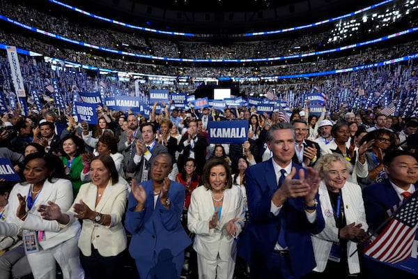 FILE - Rep. Nancy Pelosi, D-Calif., center, and California Gov. Gavin Newsom, center right, applaud as Democratic presidential nominee Vice President Kamala Harris speaks during the Democratic National Convention, in Chicago, Aug. 22, 2024. (AP Photo/Paul Sancya, File)