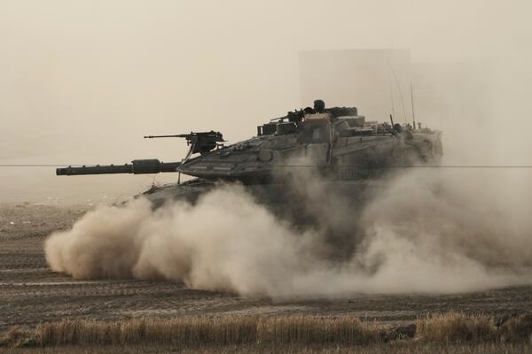 An Israeli tank moves in a staging area in southern Israel, near the border with Gaza, Friday, May 16, 2025. (AP Photo/Maya Alleruzzo)