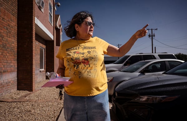 Rosana Colorbio, a resident at the Woodcrest Apartments, talks with the Journal in Las Cruces, N.M., on Saturday, March 22, 2025, as the apartments are located directly across the street from Young Park after Friday night's fatal shooting. (Chancey Bush/The Albuquerque Journal via AP)