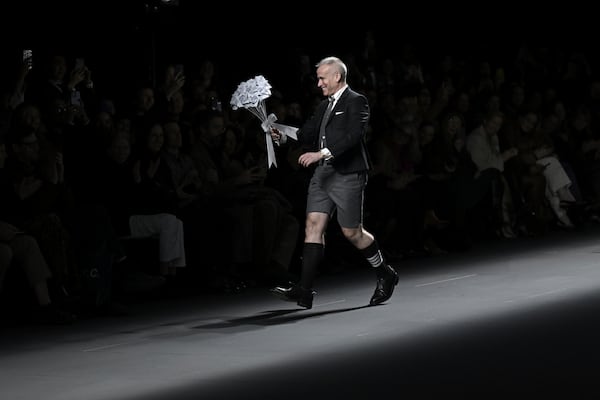 Designer Thom Browne accepts applause after the Thom Browne Fall/Winter 2025 fashion show as part of New York Fashion Week on Tuesday, Feb. 11, 2025, at The Shed in New York. (Photo by Evan Agostini/Invision/AP)