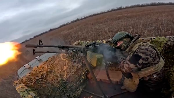 In this photo, taken from video and released by the Russian Defense Ministry Press Service on Thursday, Jan. 16, 2025, a Russian soldier tries to shoot a Ukrainian drone on an undisclosed location in Ukraine. (Russian Defense Ministry Press Service via AP)