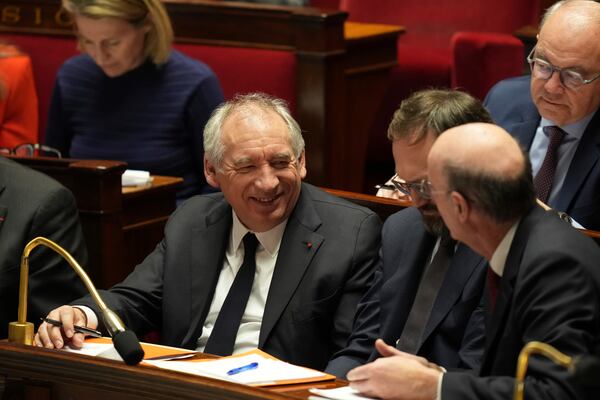 French Prime Minister Francois Bayrou sits on the ministers bench after delivering his general policy speech, Tuesday, Jan. 14, 2025 at the National Assembly in Paris. (AP Photo/Thibault Camus)