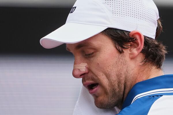 Chile's Nicolas Jarry, wearing a nasal strip, towels off as he plays France's Arthur Fils in their first round of the French Open tennis tournament at the Roland-Garros, Monday, May 26, 2025, in Paris. (AP Photo/Lindsey Wasson, File)