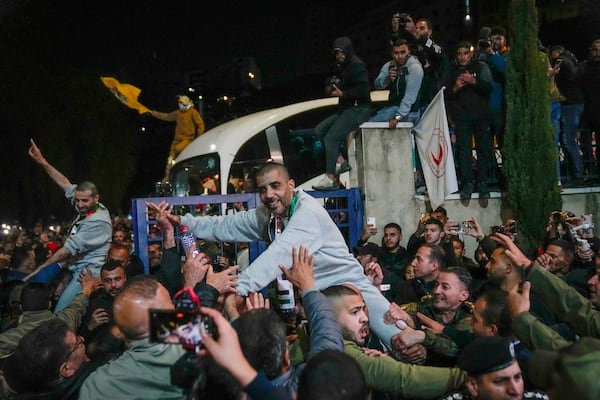 Palestinian prisoners are greeted after being released from an Israeli prison, in the West Bank city of Ramallah, Thursday Jan. 30, 2025.(AP Photo/Nasser Nasser)