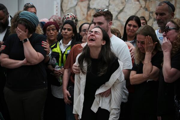 Mourners react during the funeral of Tzeela Gez, 37, an Israeli who was on her way to have her baby delivered when she was shot and killed by a Palestinian gunman in the occupied West Bank, at Givat Shaul cemetery in Jerusalem on Thursday, May 15, 2025. (AP Photo/Ohad Zwigenberg)