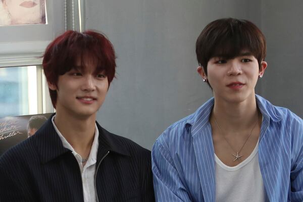 Members of K-pop band Big Ocean, PJ, left, and Chanyeon, participate in an interview with The Associated Press in Seoul, South Korea, April 15, 2025. (AP Photo/Juwon Park)