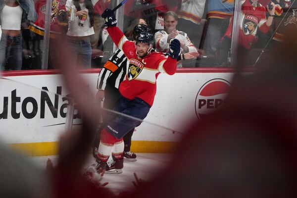 Florida Panthers' Aleksander Barkov reacts after scoring a goal during the third period against the Carolina Hurricanes in Game 3 of the NHL hockey Stanley Cup Eastern Conference finals Saturday, May 24, 2025, in Sunrise, Fla. (AP Photo/Lynne Sladky)