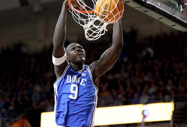 Duke center Khaman Maluach (9) dunks the ball during the first half of an NCAA college basketball game against Boston College, Saturday, Jan. 18, 2025, in Boston. (AP Photo/Mark Stockwell)