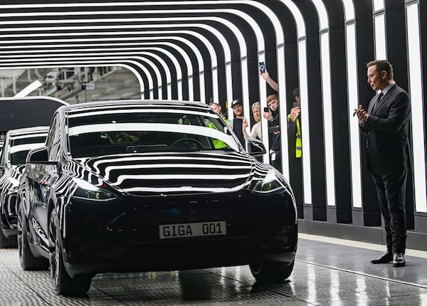 FILE - Tesla CEO Elon Musk claps hands at the opening of the Tesla factory Berlin Brandenburg in Gruenheide, Germany, Tuesday, March 22, 2022. (Patrick Pleul/Pool Photo via AP, File)