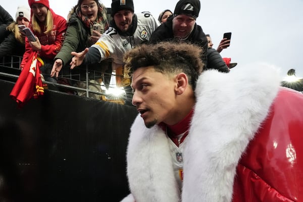 Fans cheer for Kansas City Chiefs quarterback Patrick Mahomes after an NFL football game against the Pittsburgh Steelers, Wednesday, Dec. 25, 2024, in Pittsburgh. (AP Photo/Gene J. Puskar)