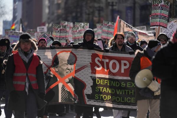 Anti-Trump protesters march to Trump Tower as they rally for a number of issues, including immigrant rights, the Israel-Hamas war, women's reproductive rights, racial equality and others, on the day of President Trump's Inauguration, Monday, Jan. 20, 2025, in Chicago. (AP Photo/Erin Hooley)