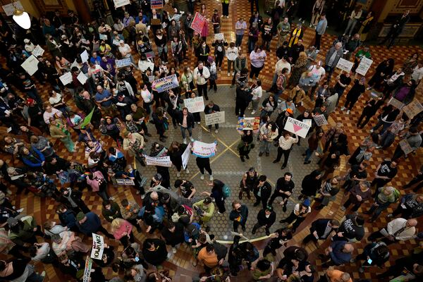 Protesters fill the Iowa state Capitol in Des Moines to denounce a bill that would strip the state civil rights code of protections based on gender identity, Thursday, Feb. 27, 2025, in Des Moines, Iowa. (AP Photo/Charlie Neibergall)