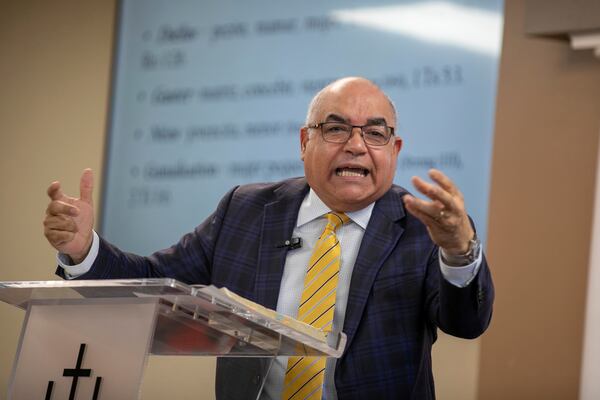 Rev. Esteban Rodriguez, who leads Centro Cristiano El Pan de Vida, a mid-size Church of God of Prophecy congregation, preaches during a worship service, in Kissimmee, Fla., Sunday, Feb. 2, 2025. (AP Photo/Alan Youngblood)