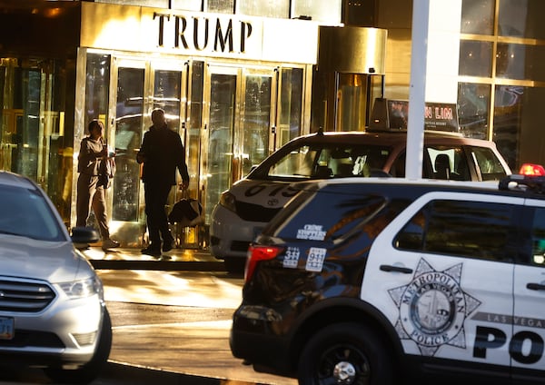 A police vehicle is parked outside Trump International Hotel, on Thursday, Jan. 2, 2025, in Las Vegas. (Bizuayehu Tesfaye/Las Vegas Review-Journal via AP)