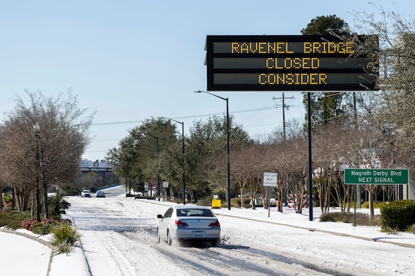 Access to the Ravenel Bridge on U.S. Highway 17 is blocked after a winter storm dropped ice and snow Wednesday, Jan. 22, 2025, on Mt. Pleasant, S.C. (AP Photo/Mic Smith)